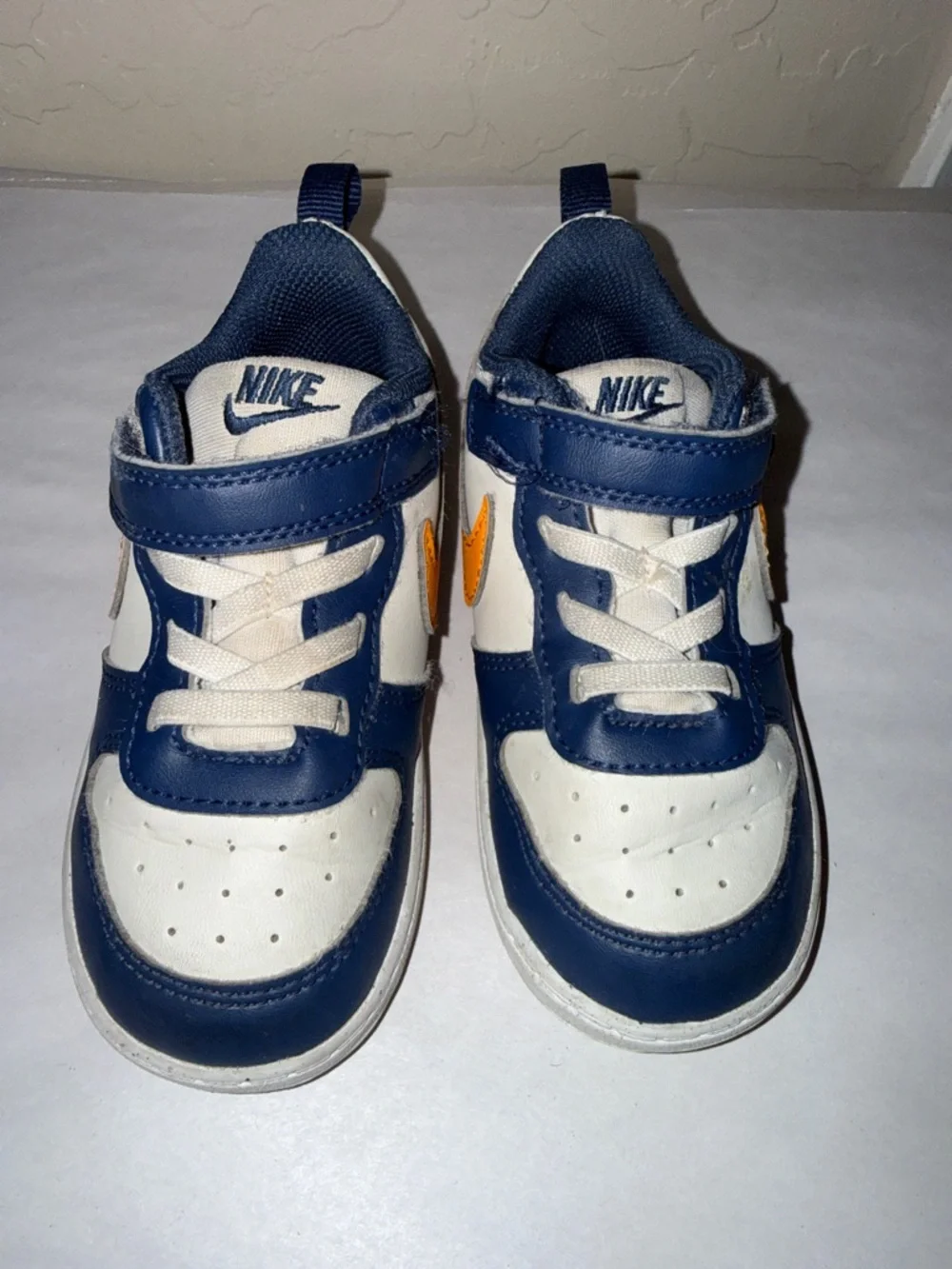 Nike court borough low top blue and orange toddler size 8.